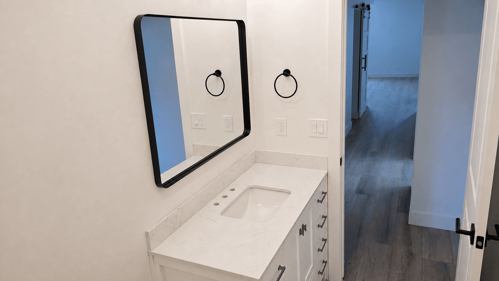 Finished basement bathroom with floating vanity